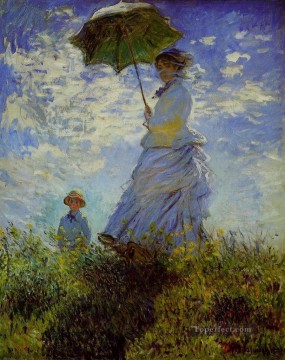 クロード・モネ Painting - 日傘をさして歩く女 クロード・モネ